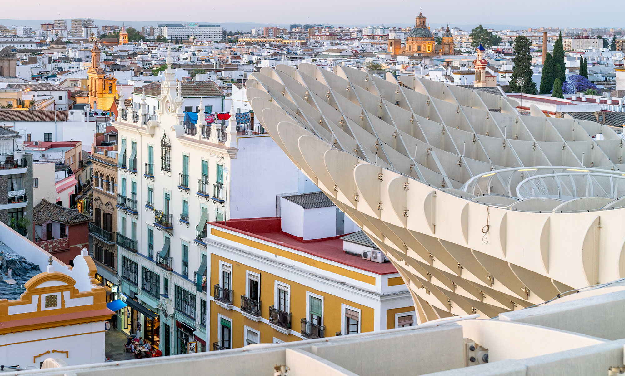 Contrast of old and new in Seville's Encarnación square, Spain